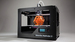 Трехмерный принтер The Makerbot Replicator 2
Трехмерный принтер компании MakerBot в четвертом поколении предназначен для более или менее массового покупателя: дизайнеров, инженеров и владельцев малого бизнеса. Позволяет “печатать” предметы из PLA-пластика шести цветов размером до 28,44 х 15,49 х 15,24 см. Представлен на Maker Faire в Нью-Йорке этой осенью.
Продается под заказ через интернет за $2199. Один килограмм PLA-пластика, используемого в Replicator 2, обойдётся в $48.