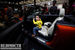 Молодой китаец примеряется к салону Mini Cooper.