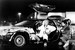 «Машина времени» DeLorean DMC-12 (1981) знакома всем по фильму Роберта Земекиса «Назад в будущее» (на фото кадр из фильма). Внешность заднемоторного купе с кузовными панелями из нержавейки и дверями-крыльями Italdesign разработало для американо-ирландской компании в середине 1970-х