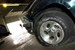 Американское подразделение Bridgestone Corporation согласилось заплатить в 2005 г. $240 млн по мировому соглашению с корпорацией Ford. Автоконцерн требовал с производителя шин компенсации за некачественные покрышки Firestone. Как подтвердило расследование Национальной администрации безопасности дорожного движения (NHTSA), дефекты в покрышках выпущенных Bridgestone до 1998 г., могли приводить к серьезным авариям внедорожников Ford Explorer, на которых они были установлены. Общественные организации и Ford утверждали, что в таких авариях к 2000 г. по всему миру погибло 271 человек и 800 были ранены