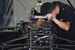Механик готовит болид пилота Ромена Грожана команды Lotus F1 Team