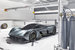 У Aston Martin есть свежий опыт создания гиперкаров. АМ-RB 001 будет производиться в Гейдоне в специальном цехе, где с 2009 по 2012 г. выпускался суперкар Aston Martin One-77 (760 л. с., 1,2 млн фунтов, 77 экземпляров). В феврале 2015 г. компания объявила о выпуске модели Vulcan (800 л. с., 24 экземпляра, 1,5 млн фунтов)