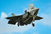 F-35B, самолет укороченного взлета и вертикальной посадки ВВС Великобритании, в режиме висения. На фото видно отклоненное вертикально вниз сопло двигателя F135-PW-600, а также открытый верхний люк и нижние створки расположенного за кабиной подъемного вентилятора. Укороченный взлет позволяет истребителю базироваться на кораблях, не оснащенных катапультой