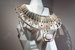 Коллекция Continuum HB-IV – четвертая по счету коллекция драгоценностей high jewellery, которую для Hermes создает Пьер Арди, арт-директор не только линии украшений, но и обуви французского дома. По случаю 25-летия его сотрудничества с Hermes в украшениях впервые не обыгрываются элементы лошадиной упряжи, а обыгрываются небесные светила. На фото: колье Attelage Celeste с розовым опалом, топазами и сапфирами