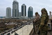 На митинге выступили муфтий Чечни Салах Межиев, депутат Госдумы Адам Делимханов, министр Чечни по национальной политике, внешним связям, печати и информации Джамбулат Умаров. Делимханов, в частности, заявил, что первый президент республики Ахмат Кадыров выбрал правильный путь, который «соответствует и канонам религии, и не идет вразрез с законодательством Российской Федерации» (цитата по «Грозный ТВ»). На фото: сотрудники правоохранительных органов следят за порядком на площади