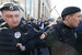 Оппозиционер Алексей Навальный (в центре) пришел на митинг против сноса пятиэтажек в Москве. Он подошел к сцене, но полиция окружила его и попросила отойти от нее