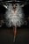 Показ Iris van Herpen вновь открыла модель в платье из многослойных изогнутых лепестков, этот ход Ирис ван Херпен использует уже не первый раз