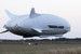 Британская аэрокосмическая компания Hybrid Air Vehicles (HAV) показала, как может выглядеть салон самого большого в мире дирижабля, который компания планирует использовать для туристических экспедиций. Позволить себе отдых на самолете-дирижабле смогут только состоятельные клиенты.Airlander 10 является гибридным дирижаблем и считается самым большим в мире летательным аппаратом. Изначально HAV разрабатывала его для нужд американской армии, однако впоследствии Пентагон отказался от проекта из-за его дороговизны.Длина дирижабля составляет около 92 м, ширина – 43,5 м, высота – почти 26 м. Его взлетная масса – до 33 т.Интерьер салона разработан компанией Design Q.Airlander 10 сможет взлететь и обеспечить высадку «практически на любую плоскую поверхность». Благодаря этому туристы смогут посетить места, недоступные для большинства транспортных средств