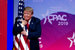 2 марта 2019 г. Дональд Трамп обнимает американский флаг во время своего выступления на конференции CPAC-2019 в Мэриленде (США)