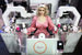 На стенде Росконгресса человекоподобный робот Дуняша компании «Промобот» продает гостям форума кофе и мороженое. Пока они ждут заказ, Дуняша говорит комплименты и предлагает послушать музыку.